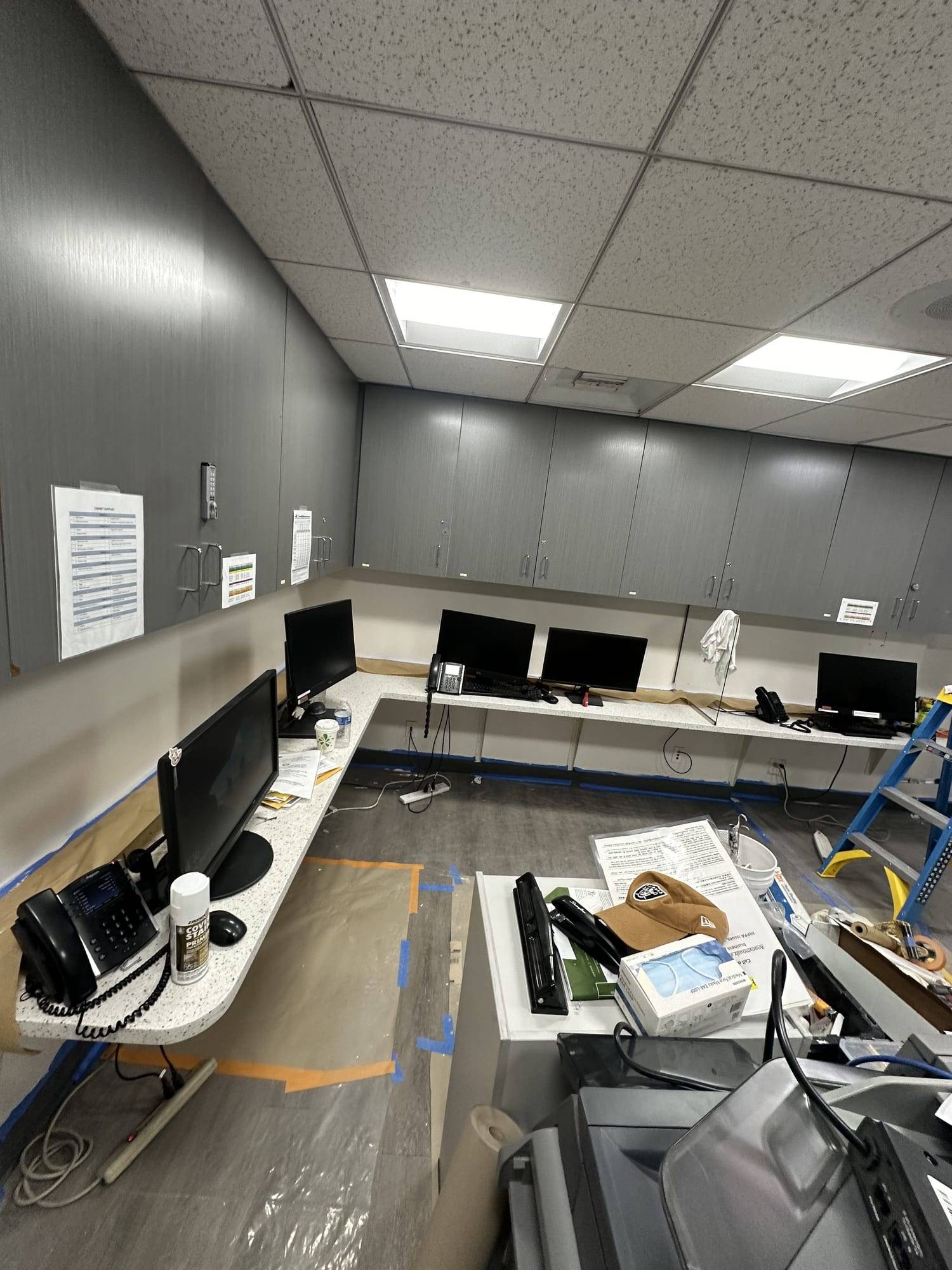 Office with gray walls during painting
