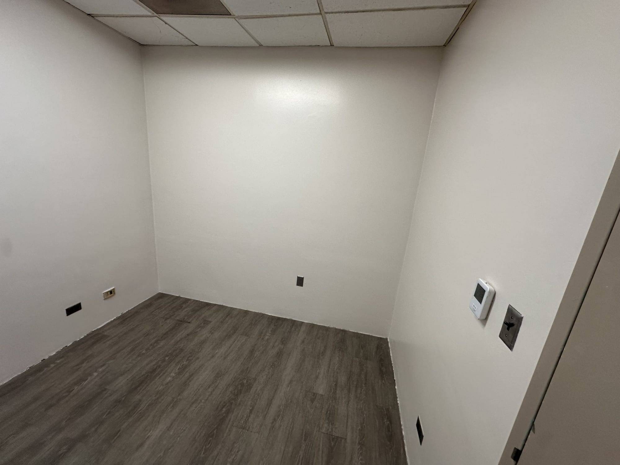 Finished white office room after a repaint