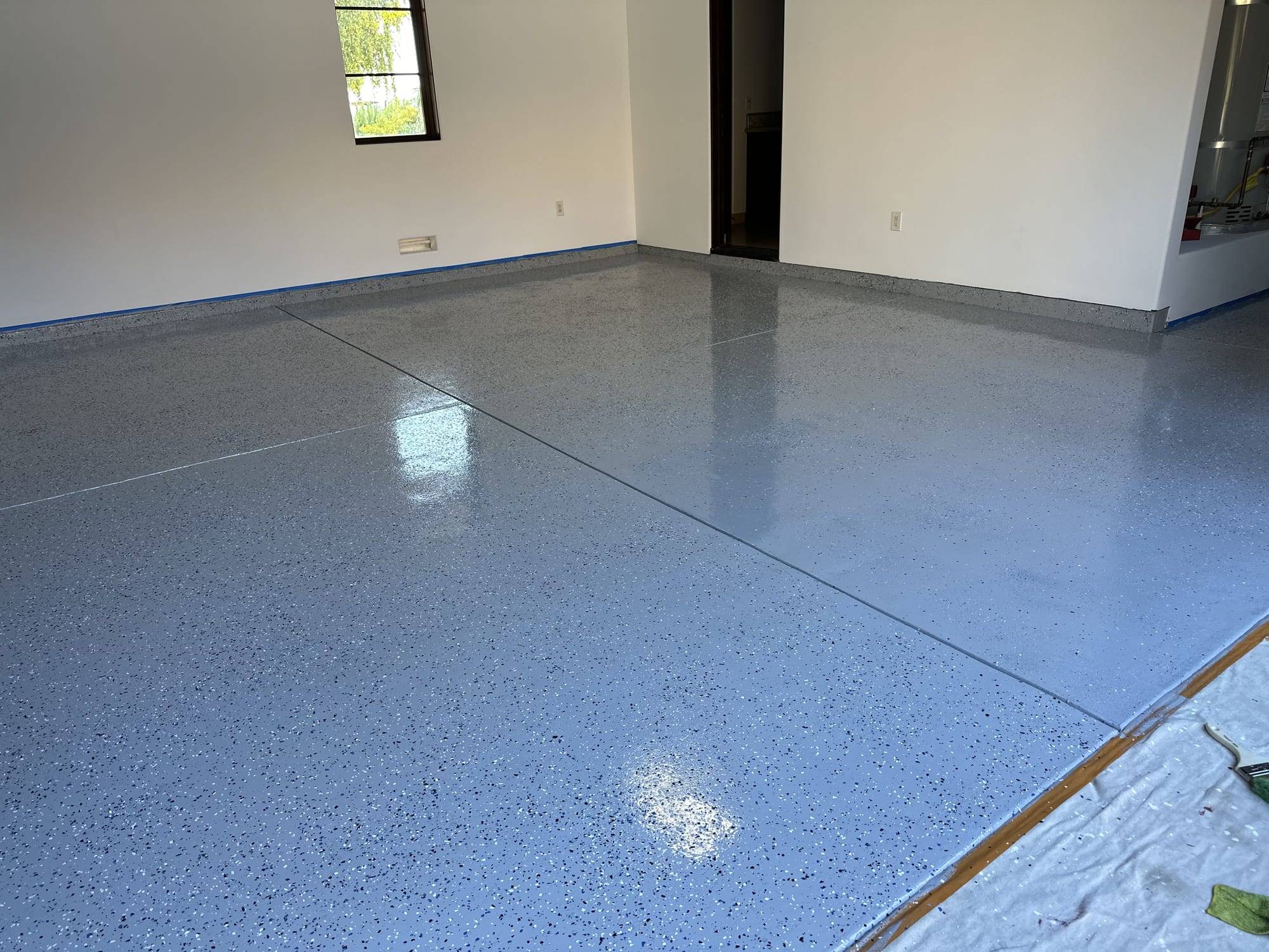 Gray flake epoxy floor with the threshold masked