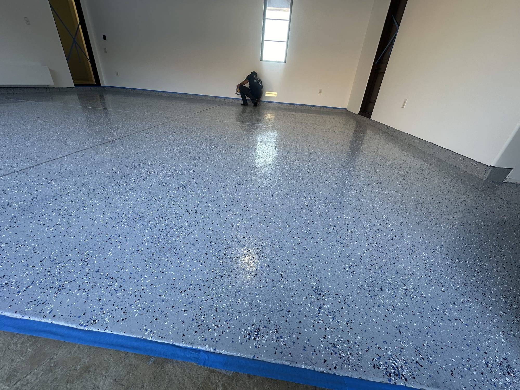 Gray flake epoxy garage floor, wide view