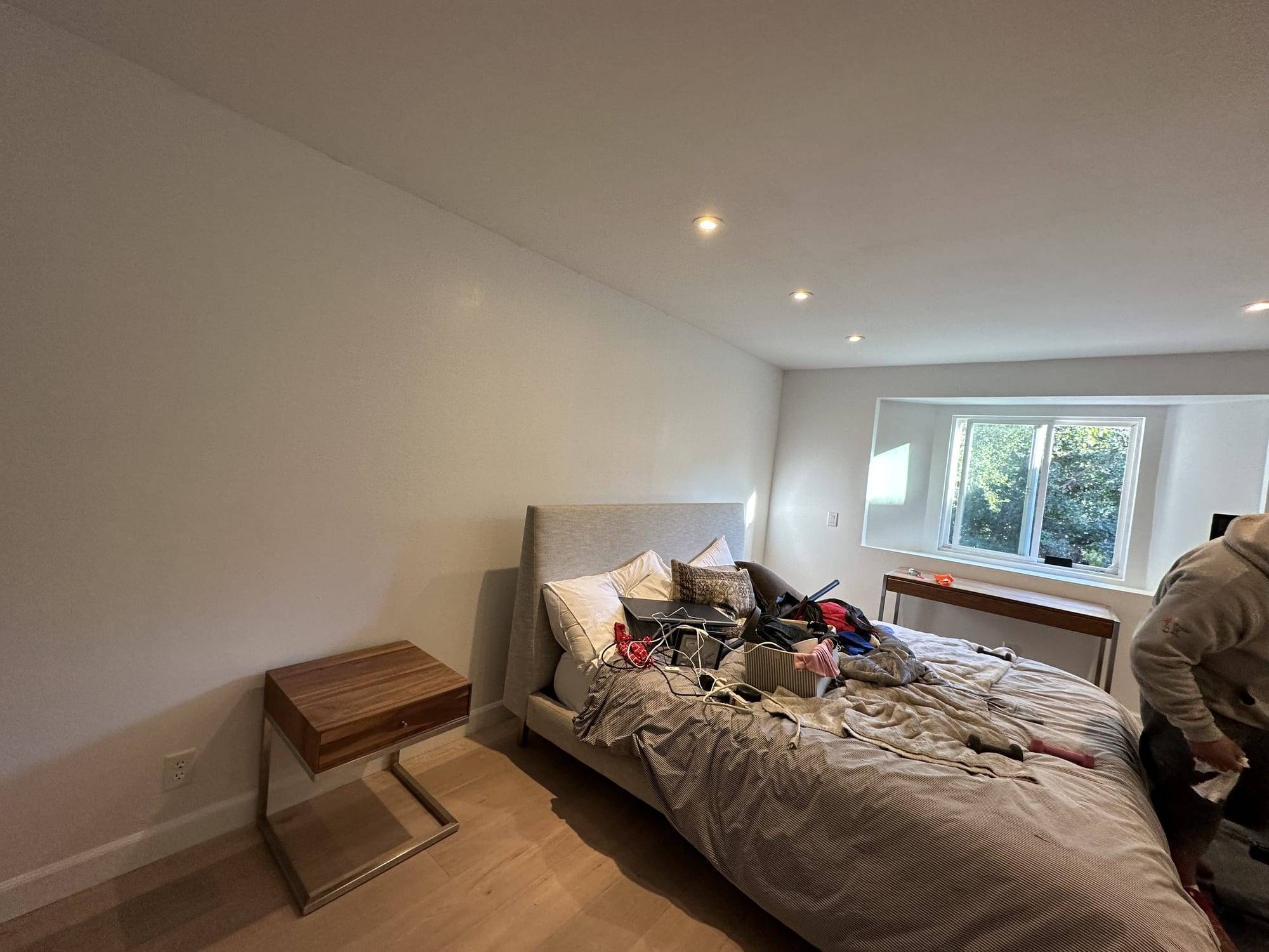 Bedroom with freshly painted walls and recessed lights