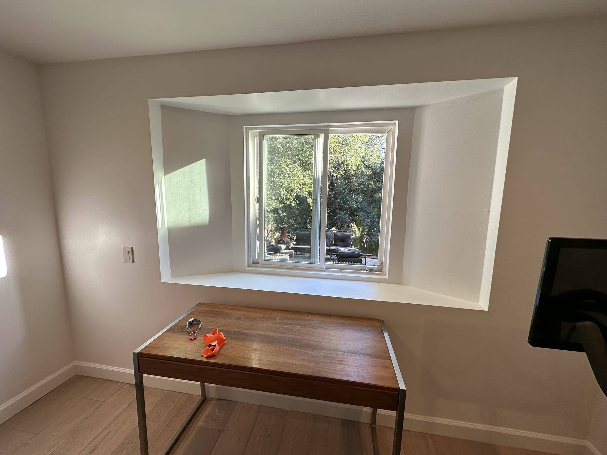 Freshly painted bedroom window recess and trim