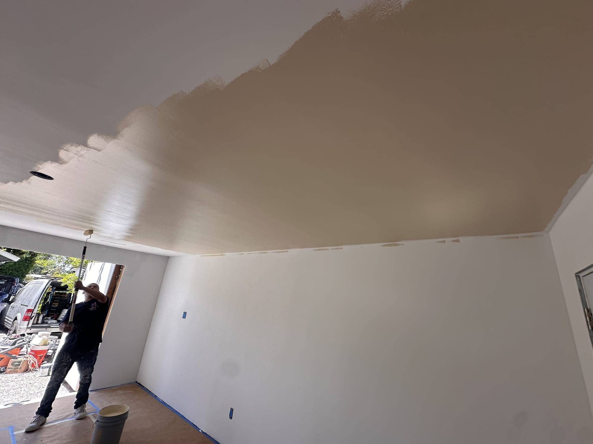 Garage ceiling paint application close-up