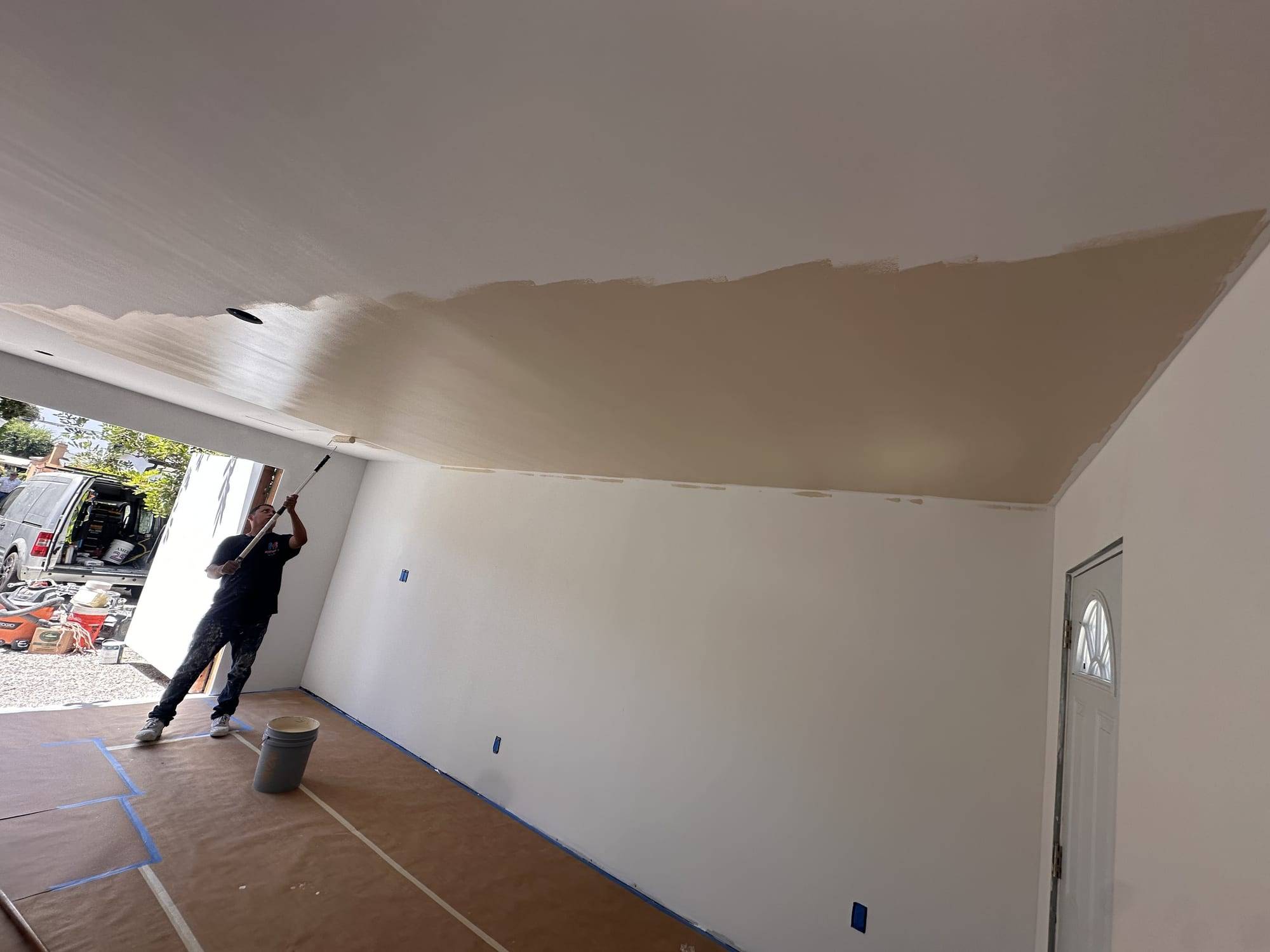 Garage ceiling being painted, wide view