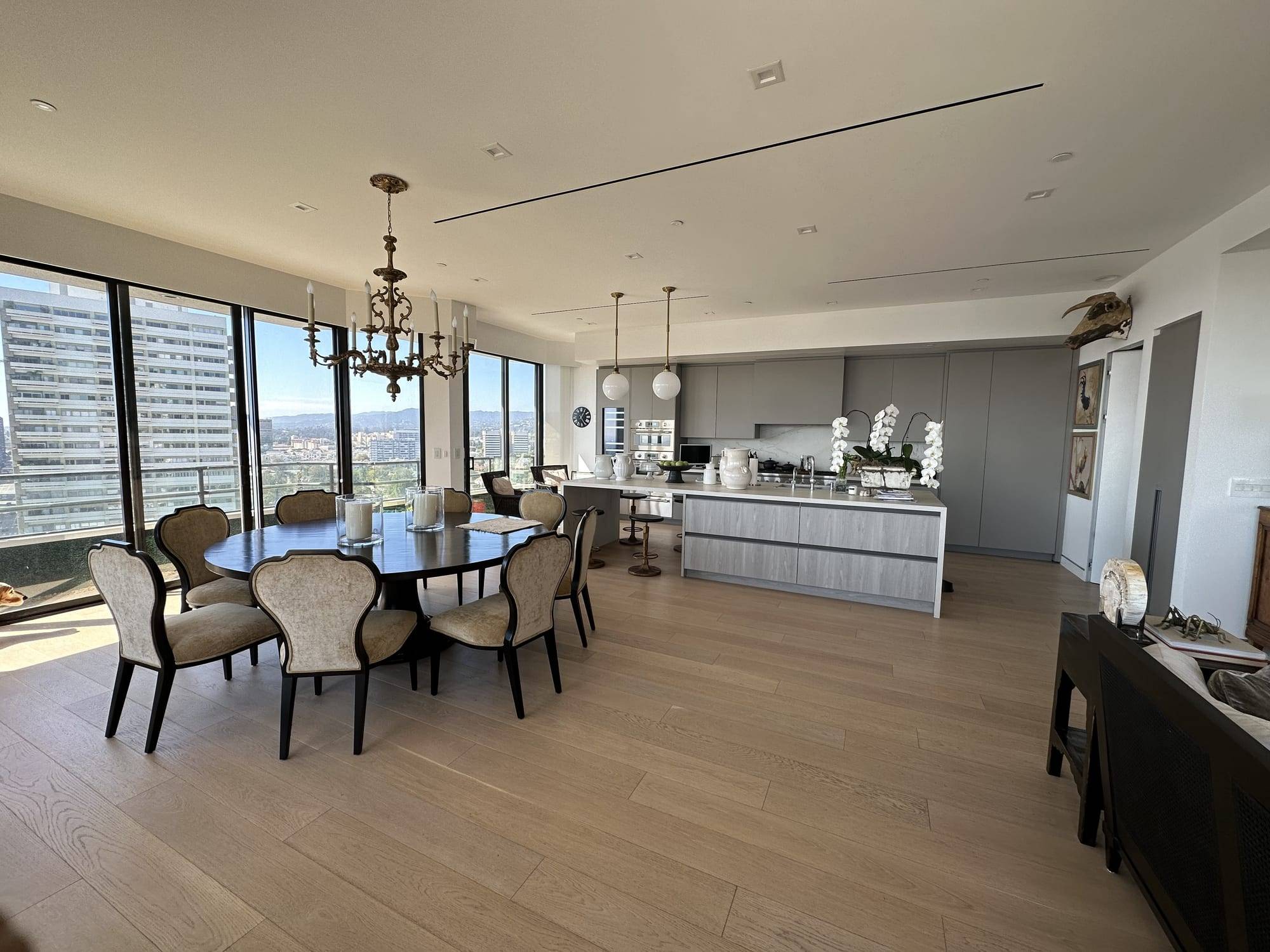 Open-plan dining room and kitchen with freshly painted white walls