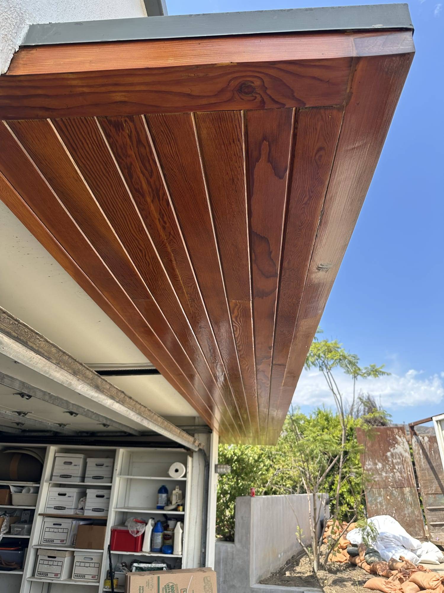 Stained exterior wood soffit seen from below